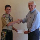 Eagle Scout receives check from Applewood