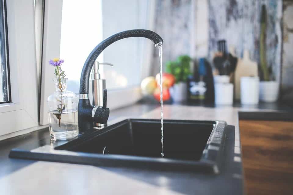 Kitchen sink with water frozen on it.