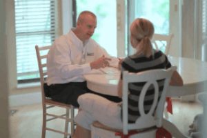 Applewood employee walks customer through the work he is about to do