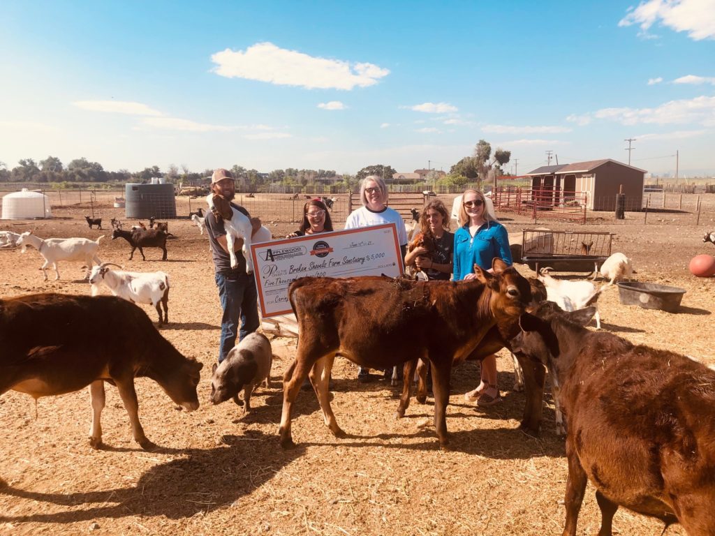 Broken Shovels Farm receives their donation from Applewood Plumbing.