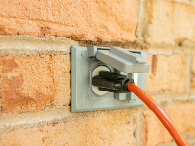 Use heavy outdoor extension cords that are rated for the proper amperage.
