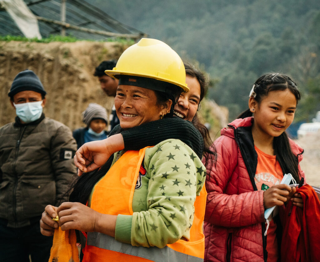 women smiling and hugging