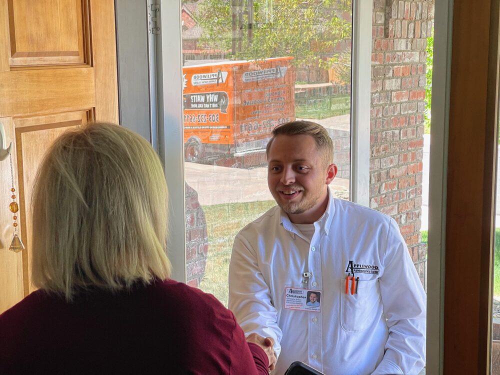 applewood employee shaking the hand of a customer
