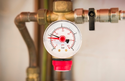 A boiler pressure gauge shows normal pressure.