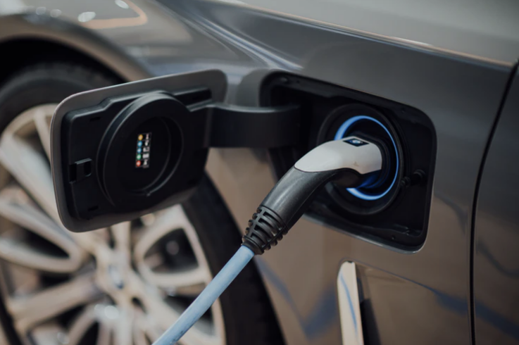 EV charging silver car.