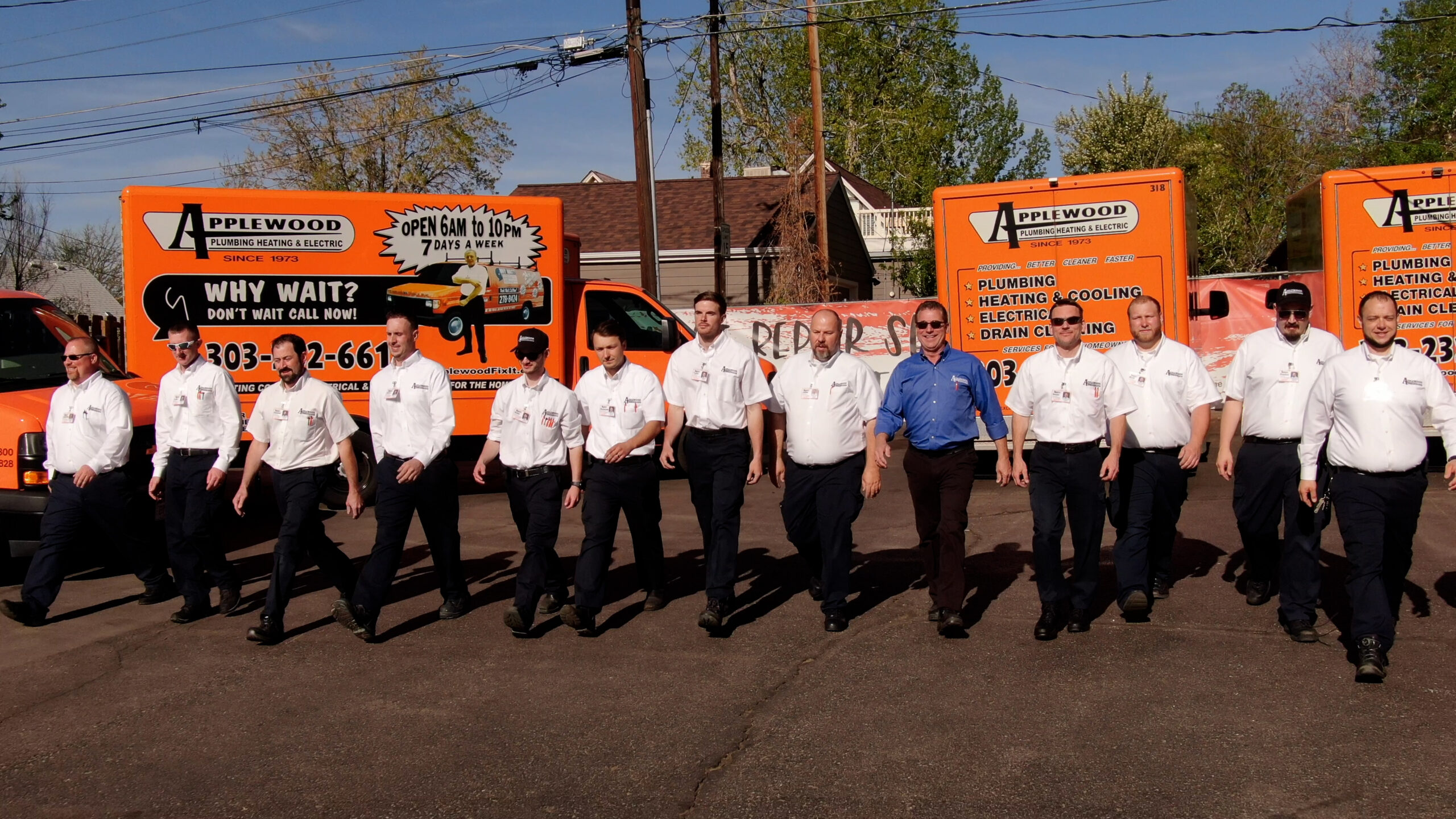 Applewood team in front of their trucks.