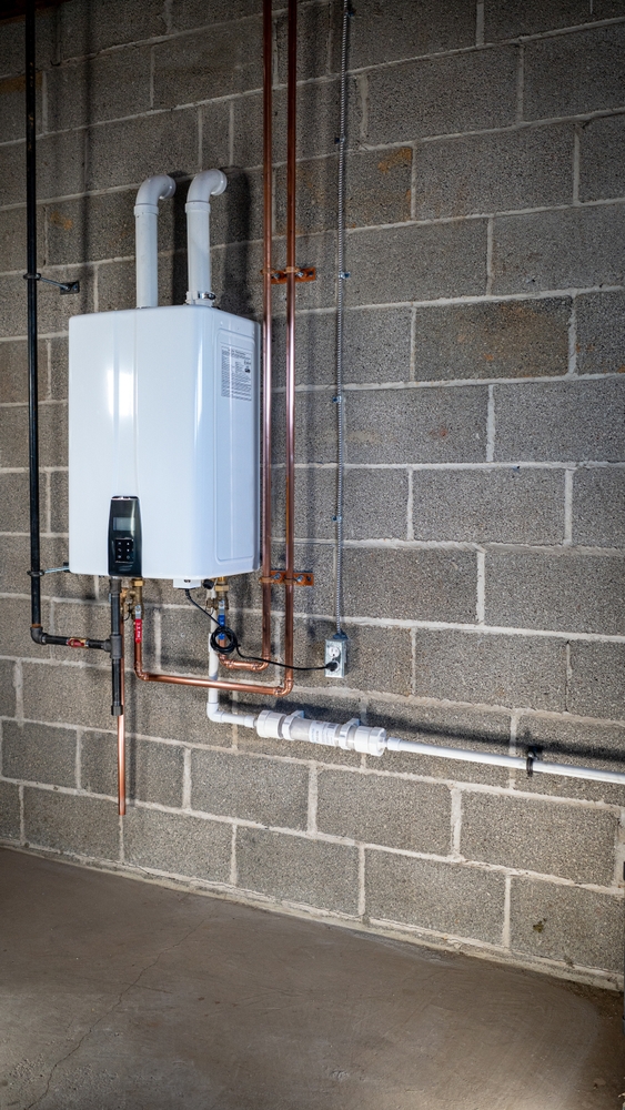 A newly installed tankless water heater in a basement.