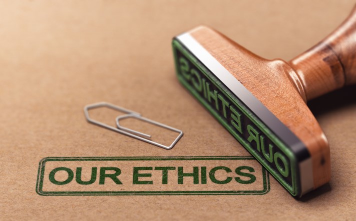 A rubber stamp with "Our ethics" printed on the page.