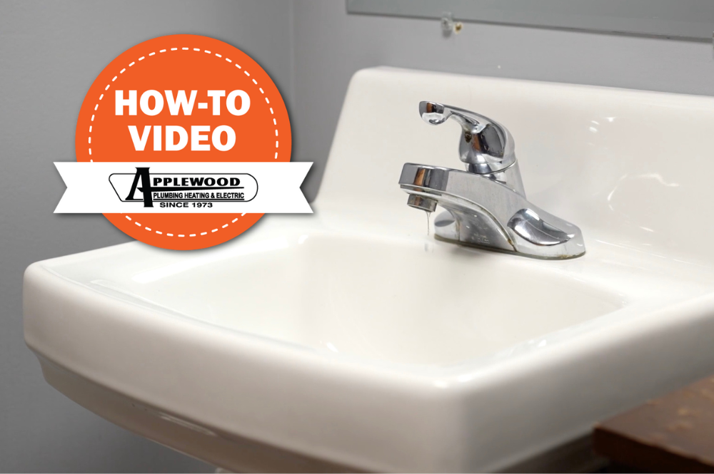 Close-up of a leaky bathroom faucet with the Applewood logo overlaid.