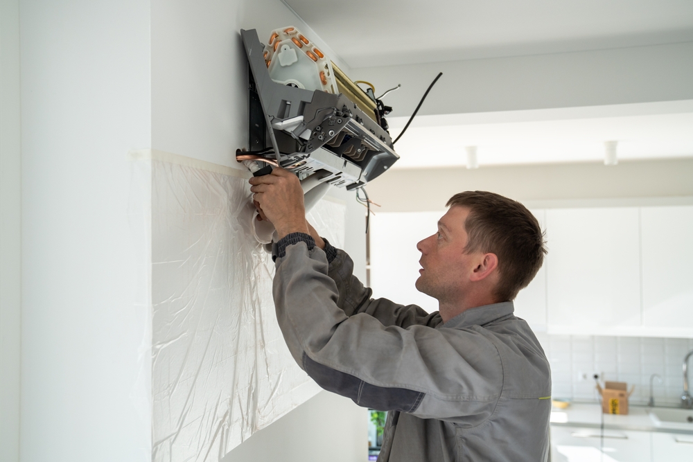 A certified technician installs a mini split in a home.