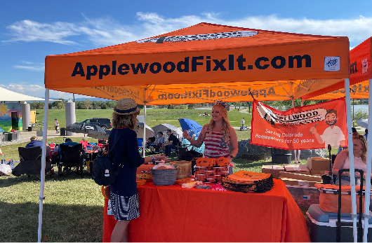 An Applewood booth at a community gathering. 