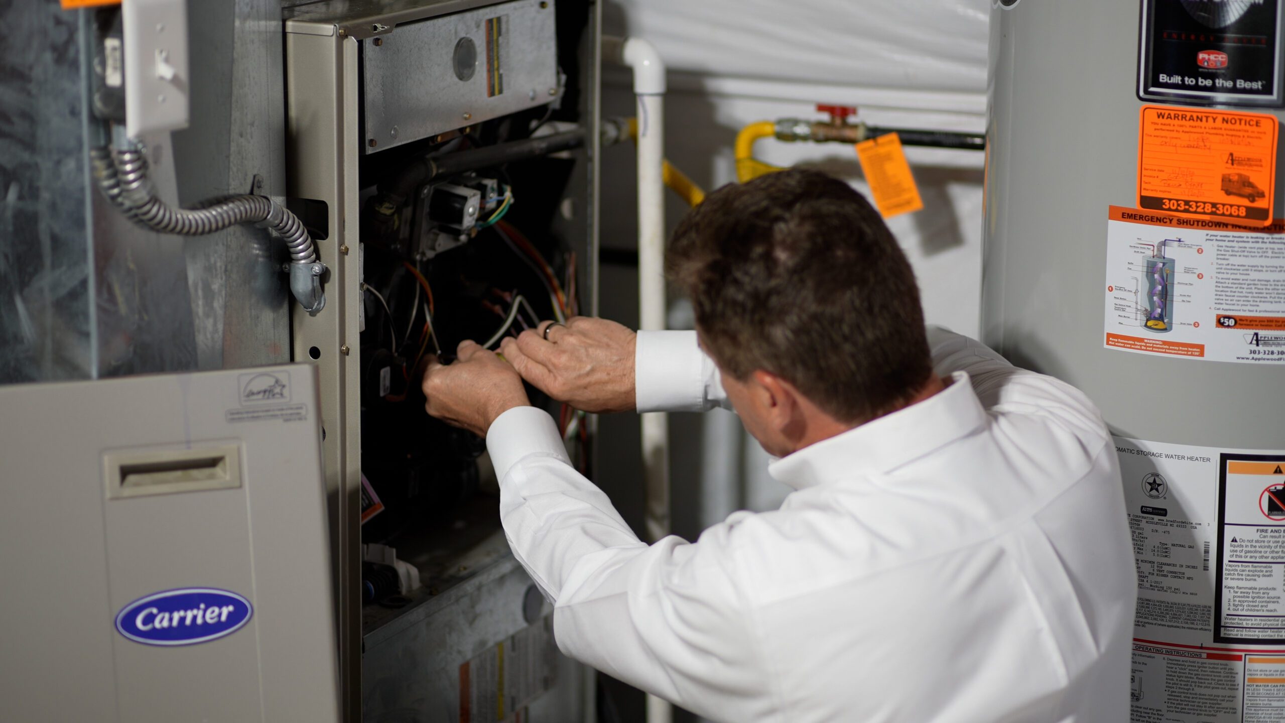 hvac technician fixing furnace