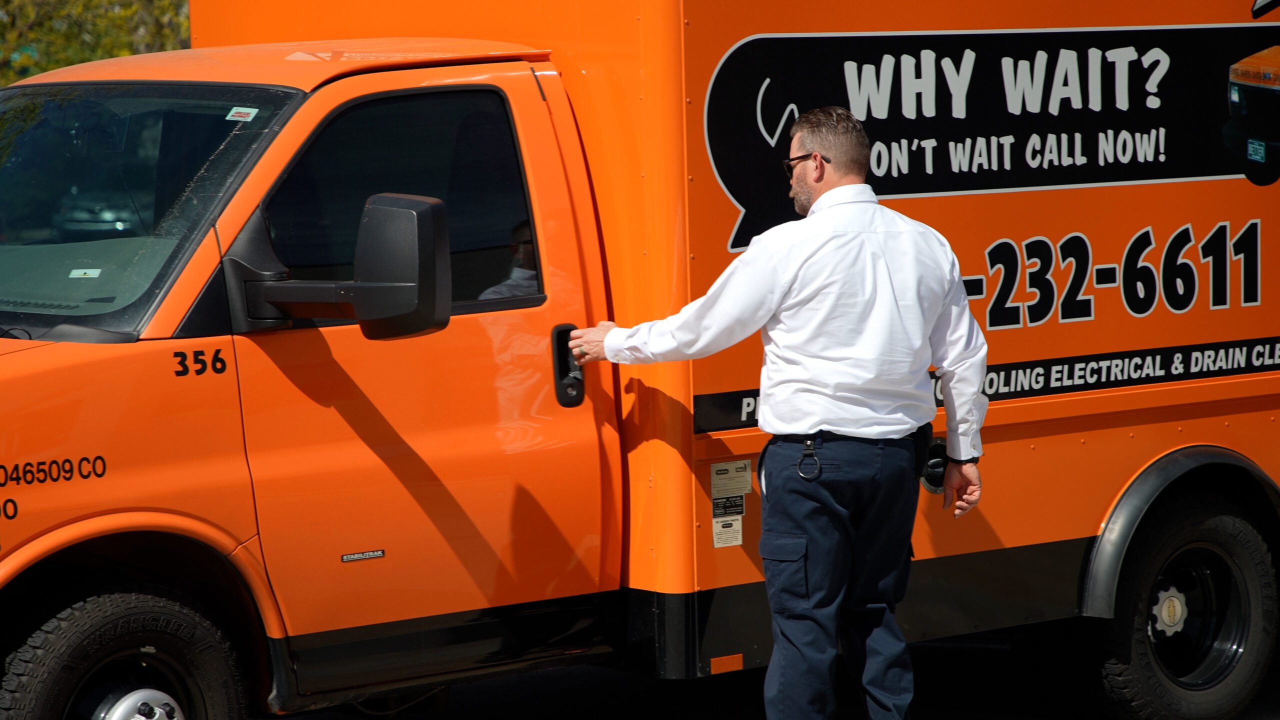 applewood employee entering orange applewood truck